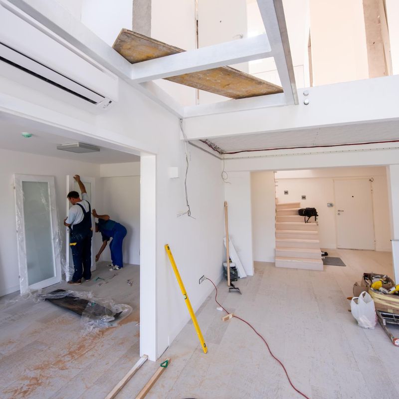 Workers fitting interior doors during a home renovation
