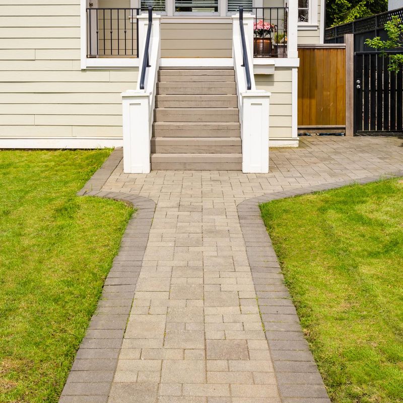 Finished paver walkway leading to residential front steps